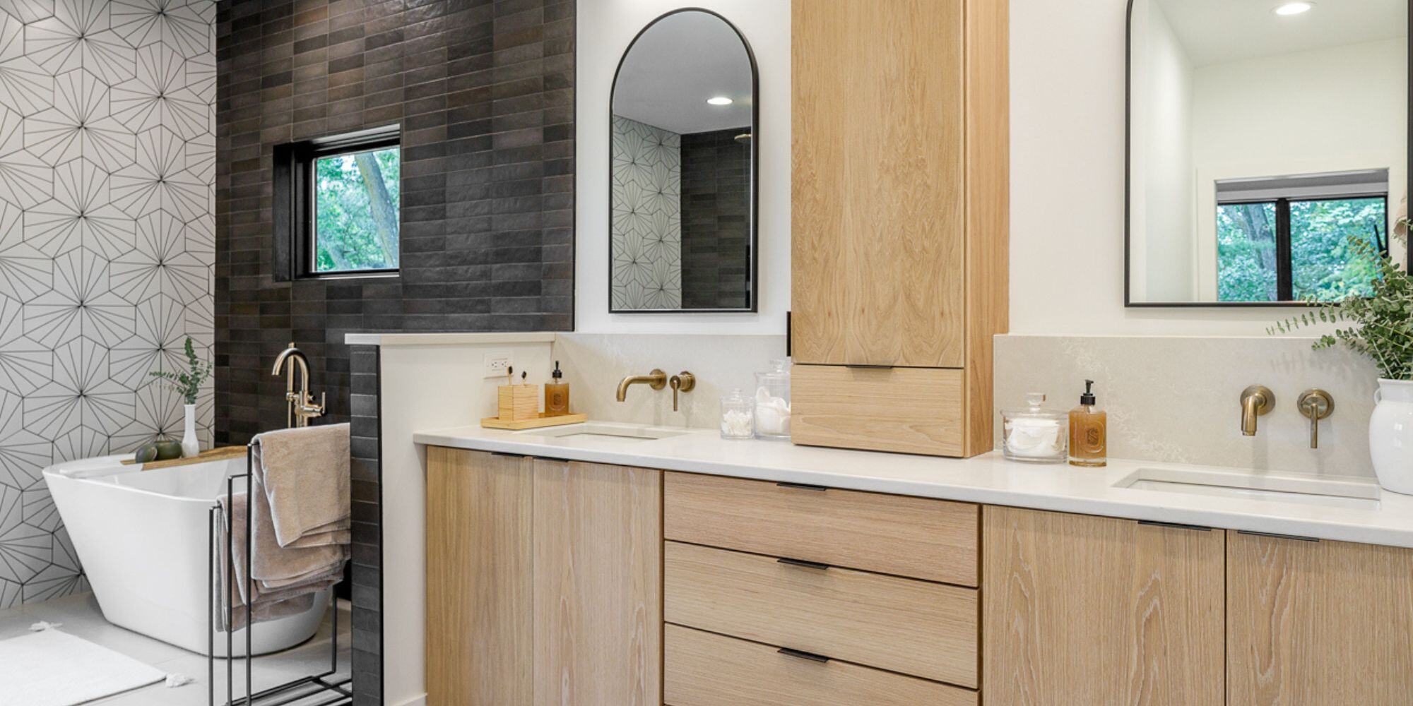 Bathroom with Black Tile and Wood Cabinets from Home Remodel in Des Moines