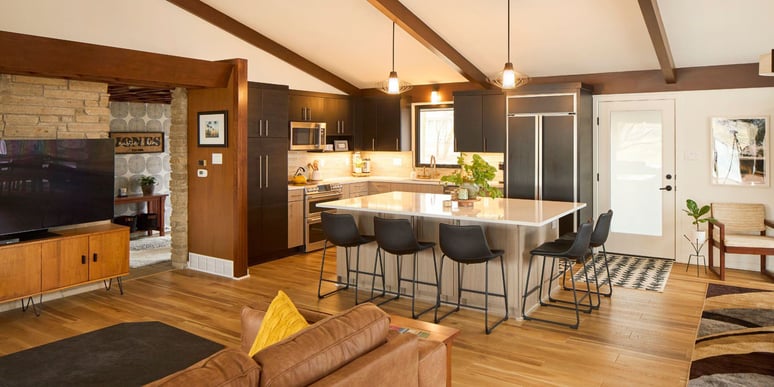 Warmly Lit Home with Wood Floors and White Marble Countertop