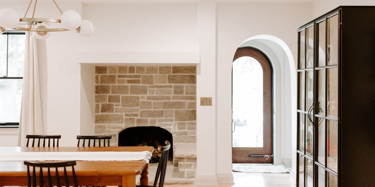 Dining room in remodeled home in Des Moines, Iowa with stone fireplace