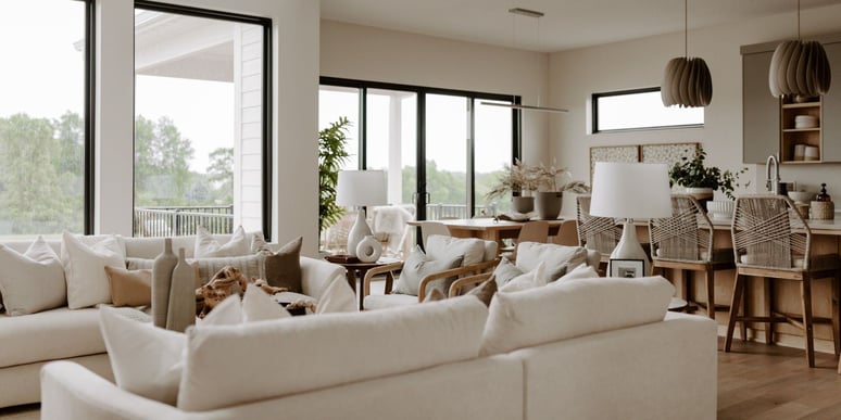 Home remodel in Des Moines with open layout kitchen and living area, neutral tones, and black window frames