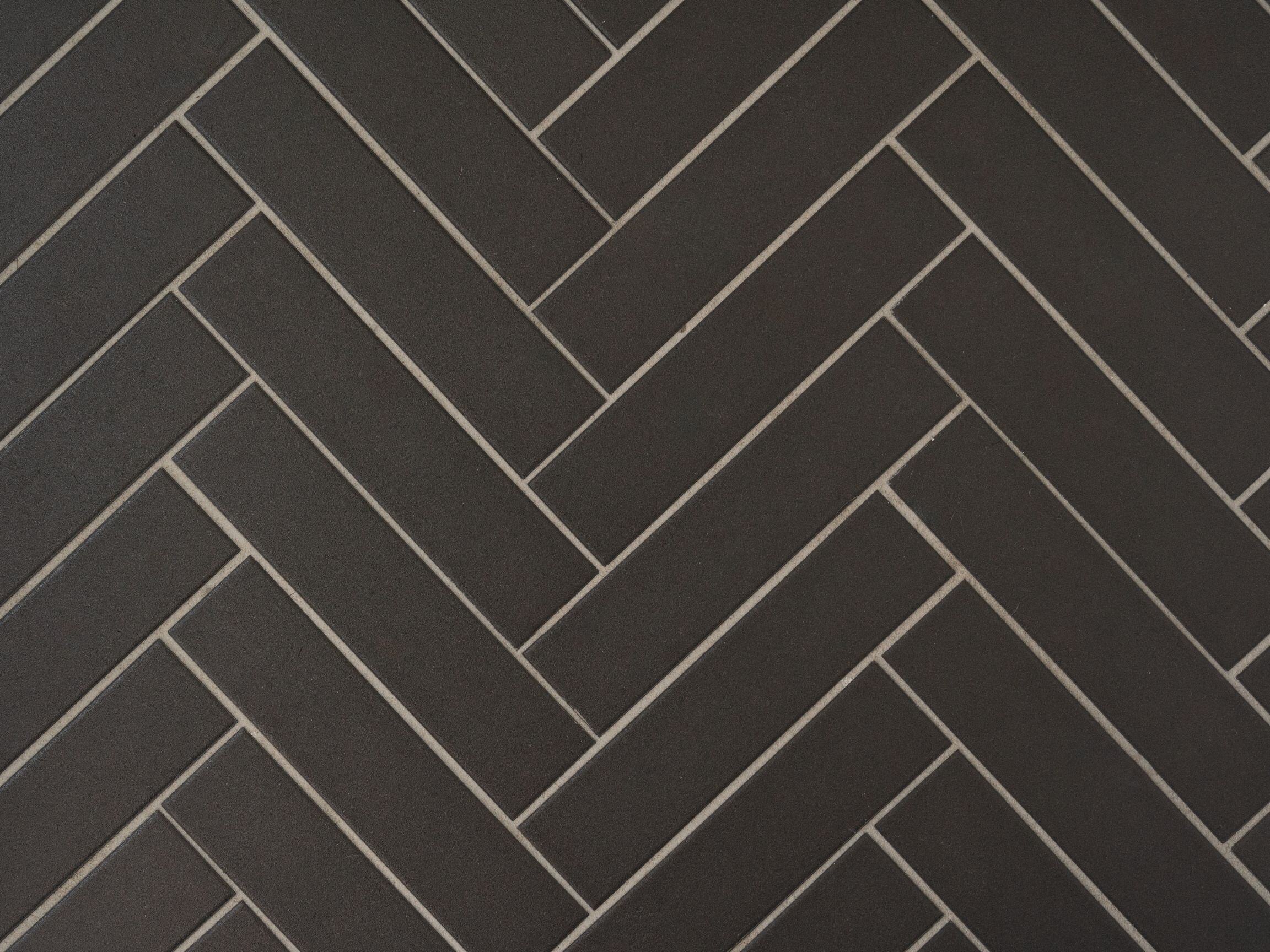 black matte herringbone bathroom tile detail image