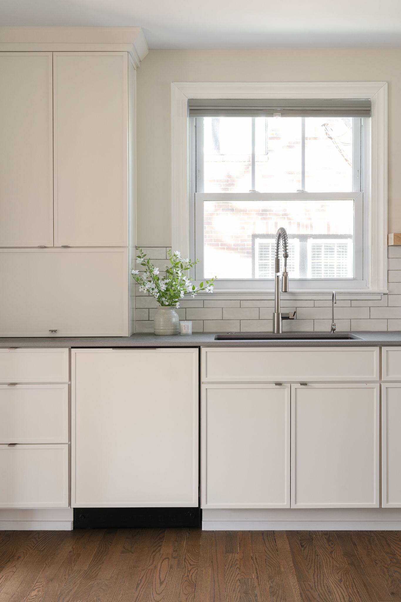 white kitchen cabinets and white backsplash in a modern kitchen remodel in des moines