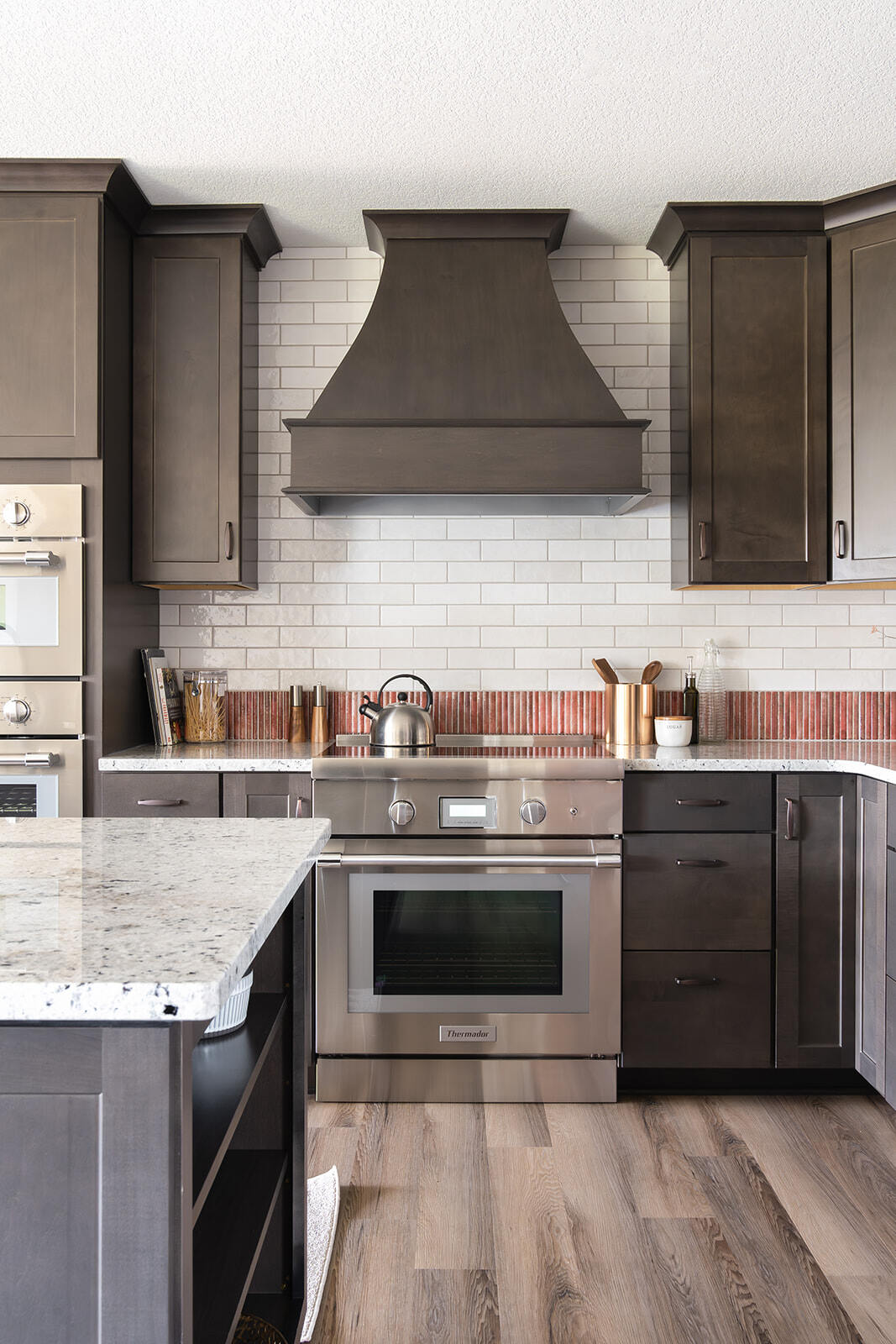 Stainless steel oven and dark cabinets in a remodeled kitchen in Urbandale, IA