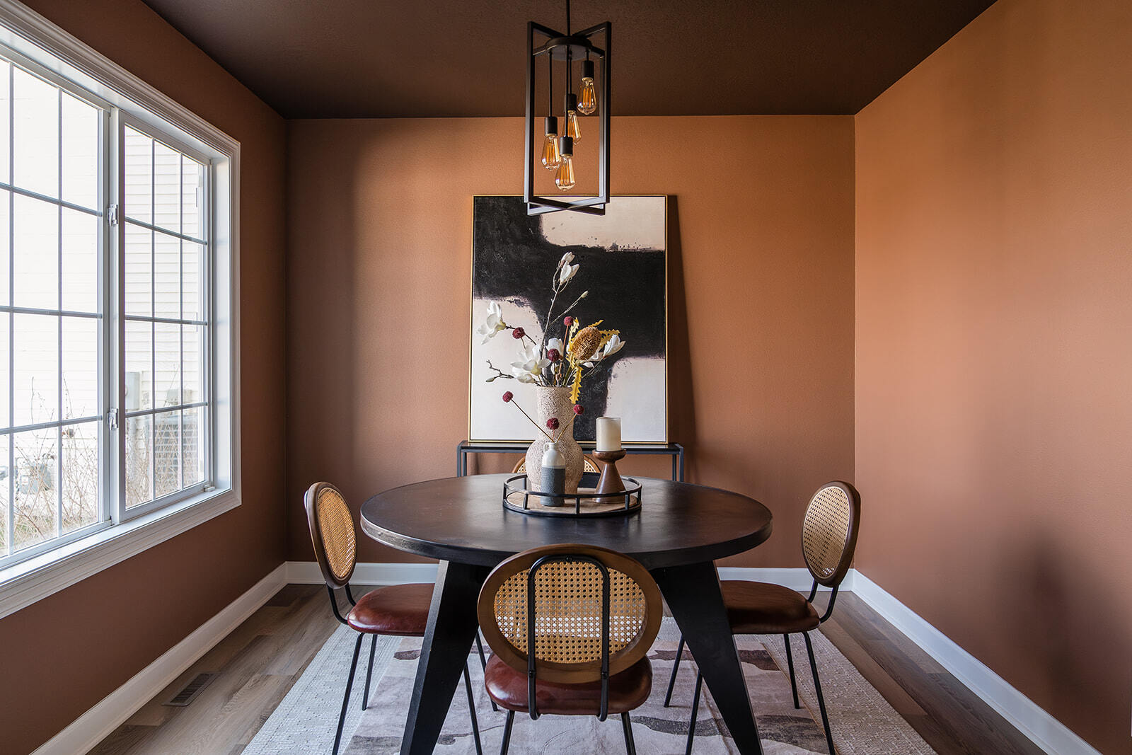 wide shot of dining room renovation with wooden floors and clay walls in Urbandale, Iowa