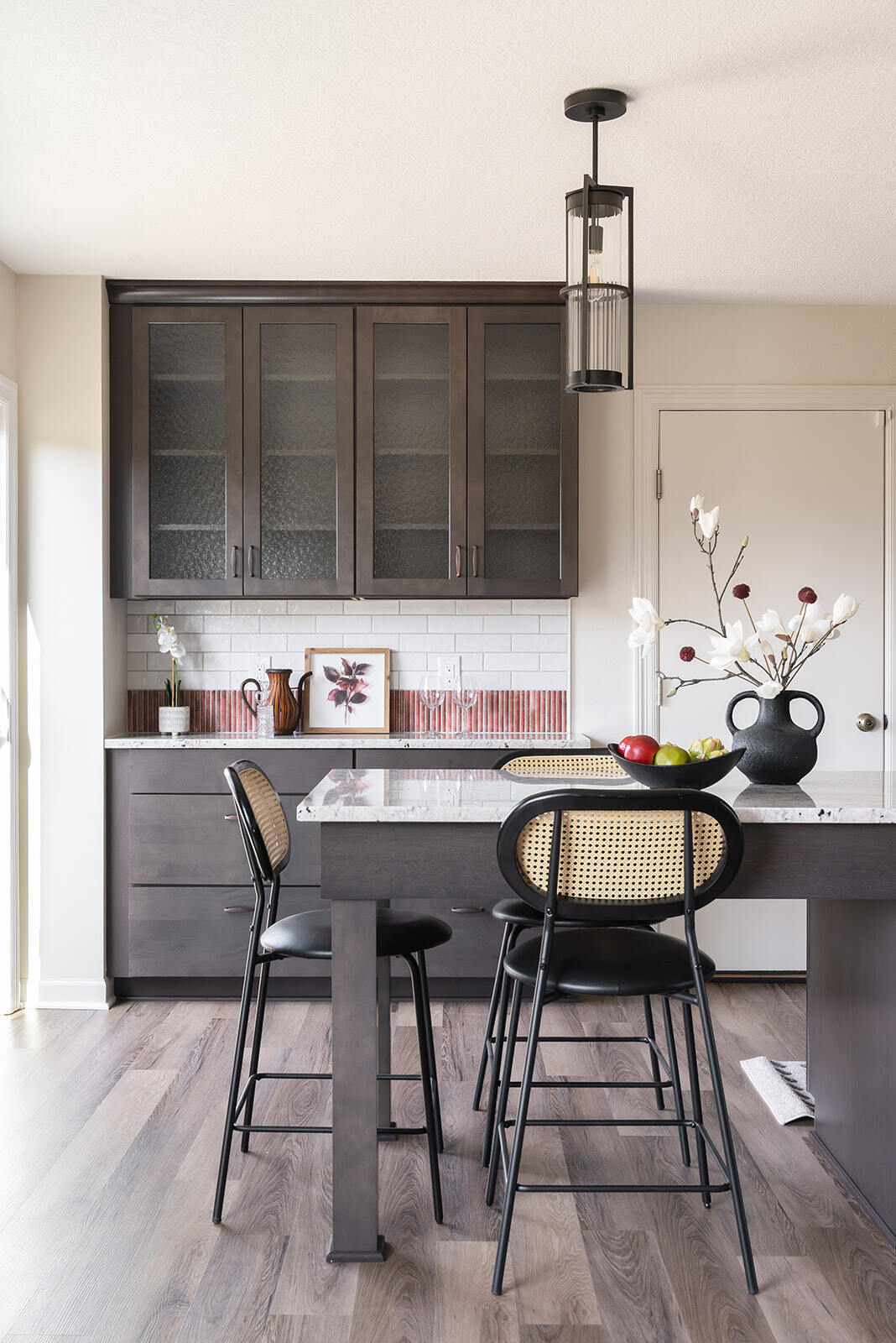 Kitchen renovation with wooden floors, coffee bar, and large kitchen island with bar stools