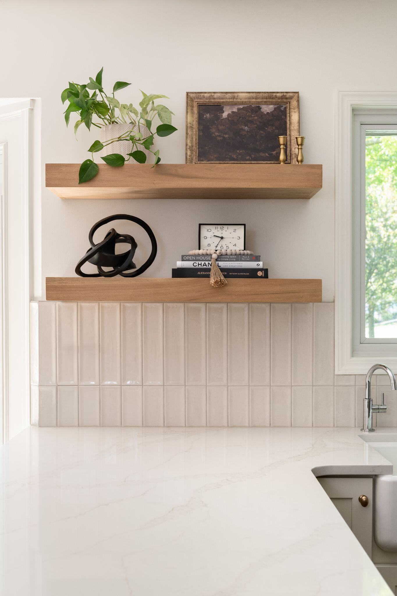 open kitchen shelving in a modern white kitchen remodel in Clive, Iowa