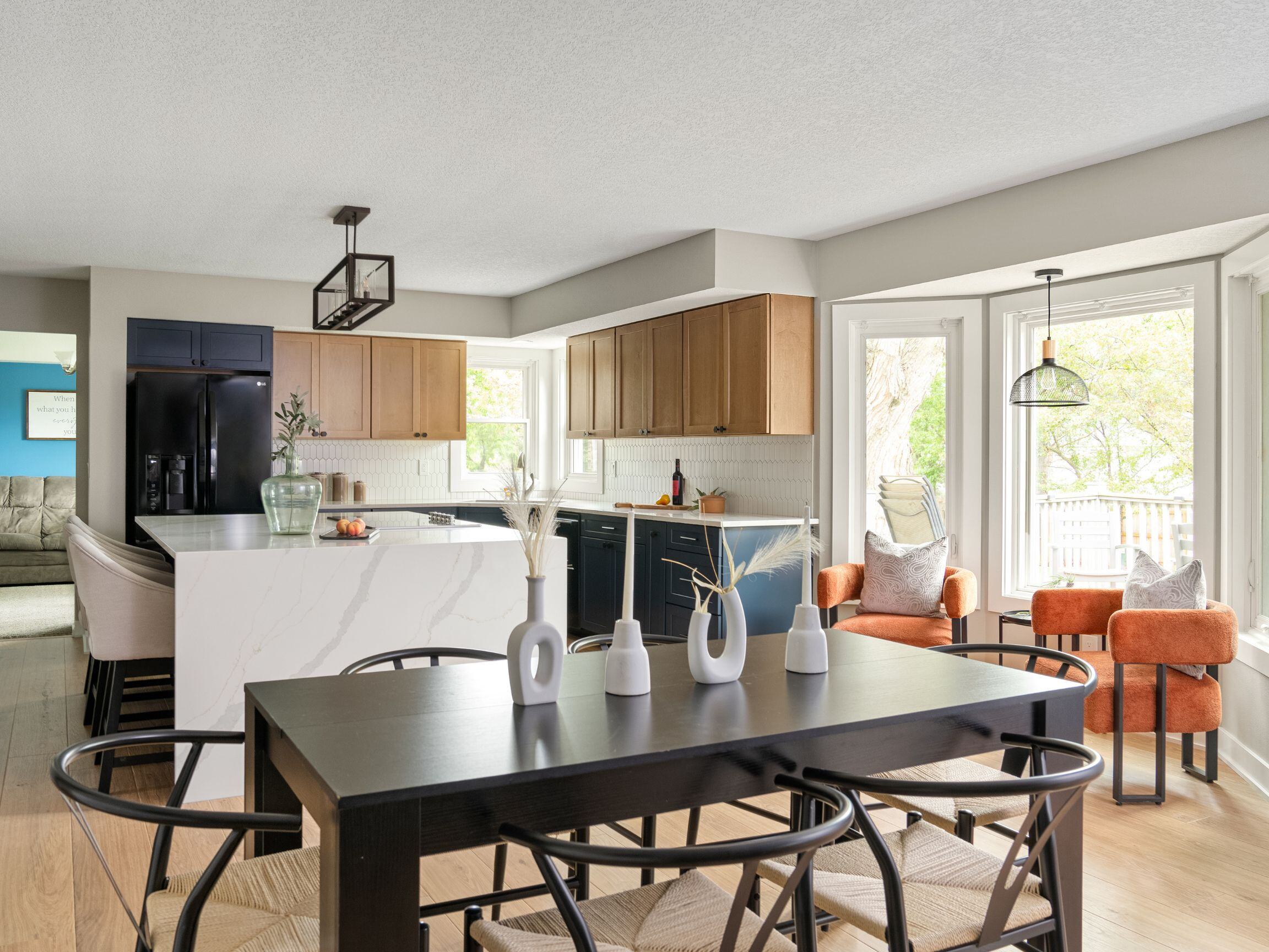 open layout kitchen remodel in des moines iowa with dining table, breakfast nook, and kitchen island